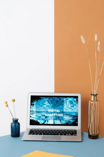 A contemporary tablet showing a search engine logo beside a wireless keyboard on a wooden desk.